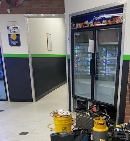 Glass-door frozen food freezer repair at a convenience store in Northern Illinois